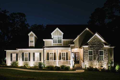 Exterior home with specialty lighting